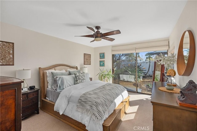 carpeted bedroom featuring access to exterior and ceiling fan