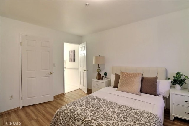 bedroom featuring light wood-type flooring