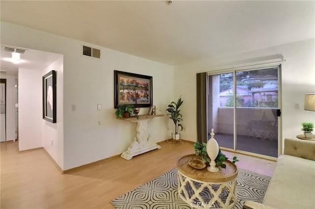 living room with light hardwood / wood-style flooring