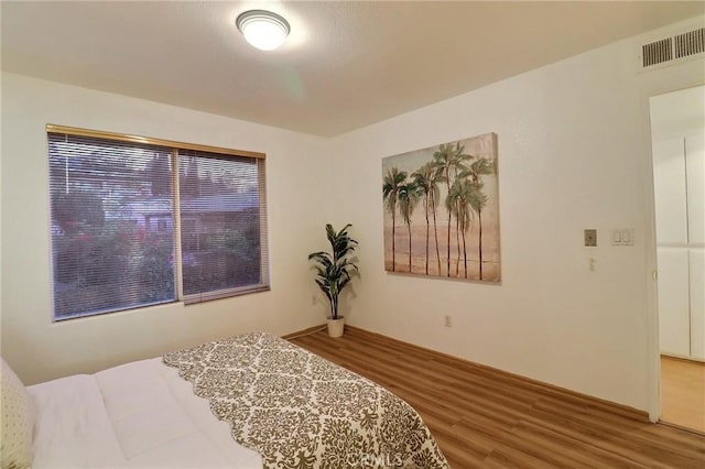 bedroom featuring hardwood / wood-style floors