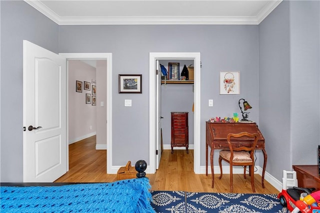 bedroom with crown molding and hardwood / wood-style flooring