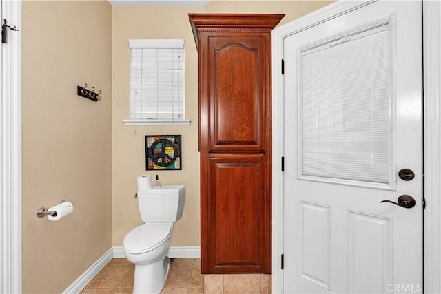 bathroom with tile patterned floors and toilet