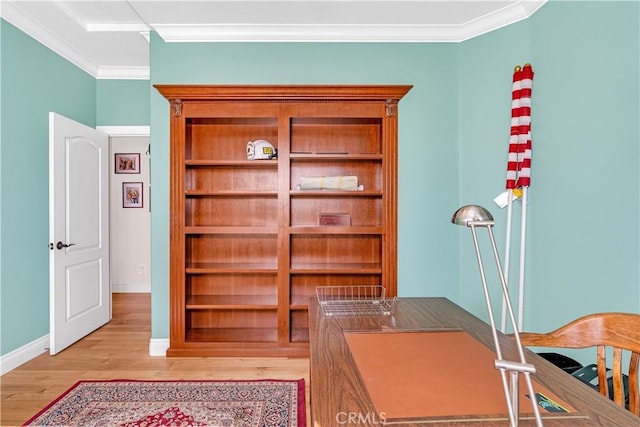 office space featuring crown molding and light hardwood / wood-style floors