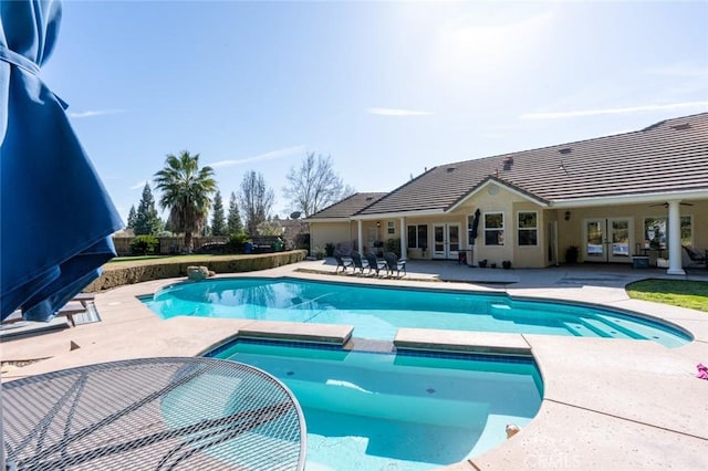 view of swimming pool with a patio area