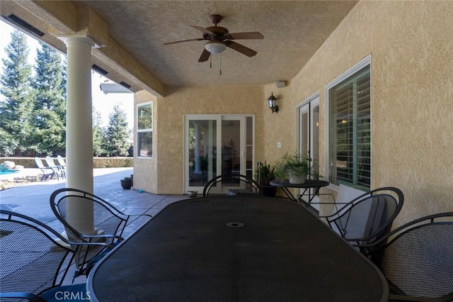 view of patio featuring ceiling fan