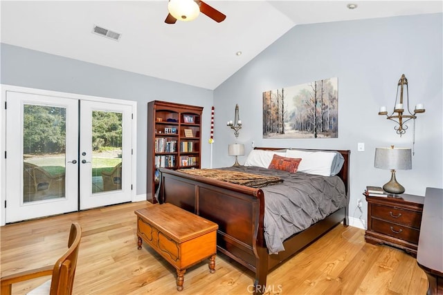 bedroom with french doors, lofted ceiling, light hardwood / wood-style floors, and access to outside