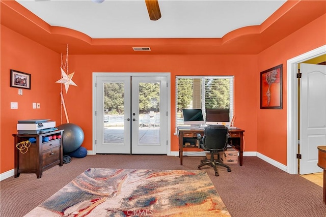 carpeted home office featuring french doors