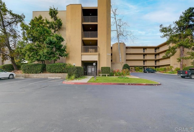 5708 Baltimore Dr Unit 376, La Mesa, CA 91942 - view of building exterior with uncovered parking