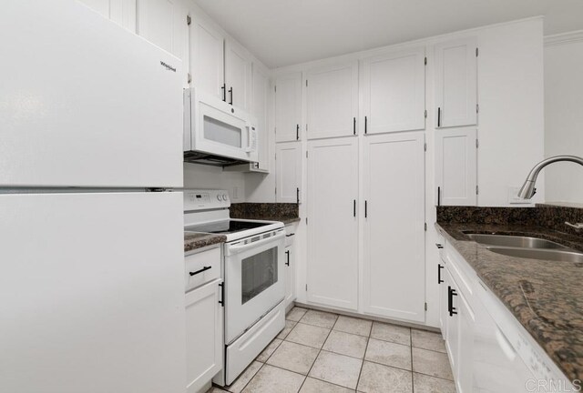 5708 Baltimore Dr Unit 376, La Mesa, CA 91942 - kitchen featuring white appliances, dark stone counters, a sink, light tile patterned flooring, and white cabinets