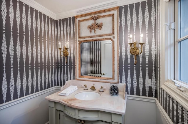 bathroom with vanity and ornamental molding