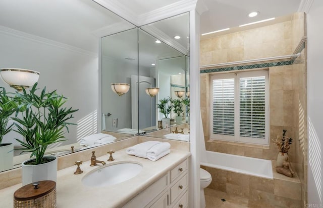 bathroom featuring crown molding, vanity, and toilet