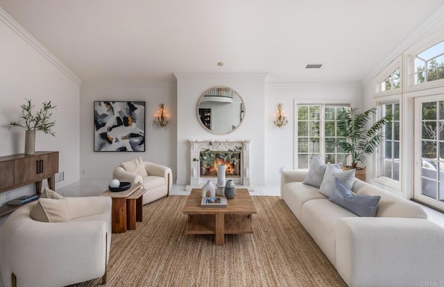 living room with crown molding and a fireplace