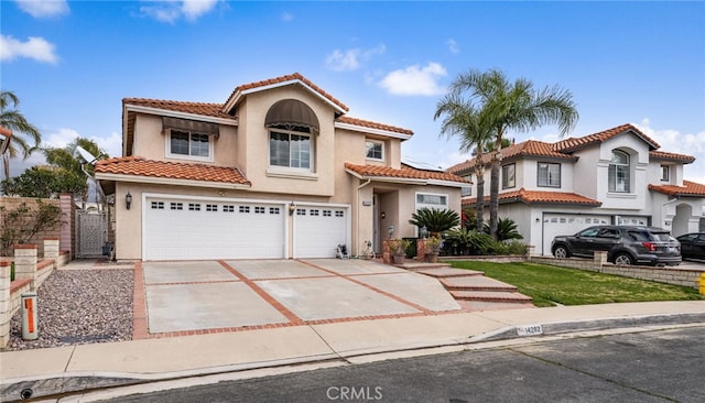 mediterranean / spanish home featuring a garage