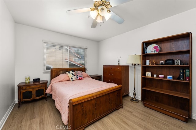 bedroom featuring light hardwood / wood-style flooring and ceiling fan