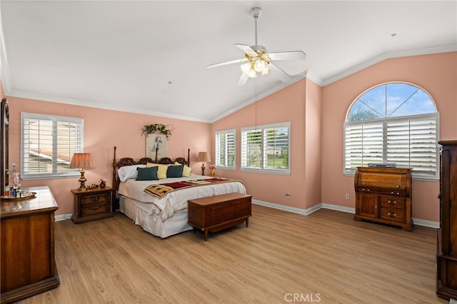 bedroom with vaulted ceiling, ceiling fan, crown molding, and light hardwood / wood-style floors