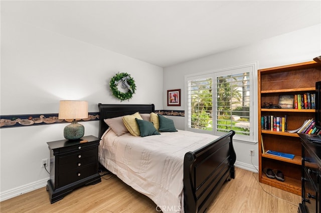 bedroom with light wood-type flooring