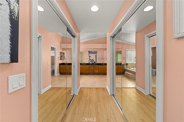 hallway with light wood-type flooring