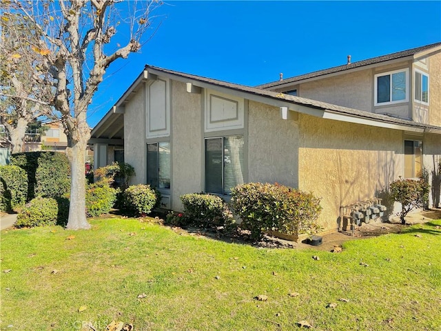 view of home's exterior featuring a lawn