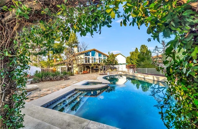 23216 Park Esperanza, Calabasas, CA 91302 - view of pool featuring a fenced backyard, a wooden deck, a patio, and a pool with connected hot tub