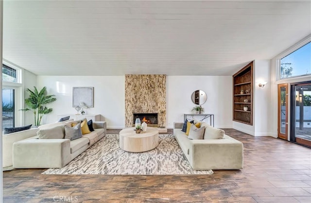 23216 Park Esperanza, Calabasas, CA 91302 - living room with built in shelves, a fireplace, and baseboards