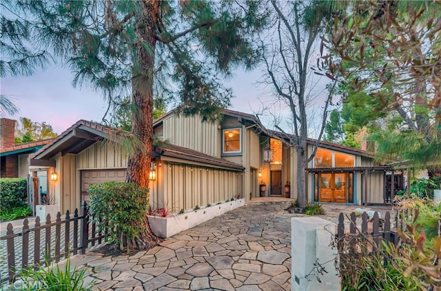 23216 Park Esperanza, Calabasas, CA 91302 - mid-century inspired home with a garage, fence, and board and batten siding