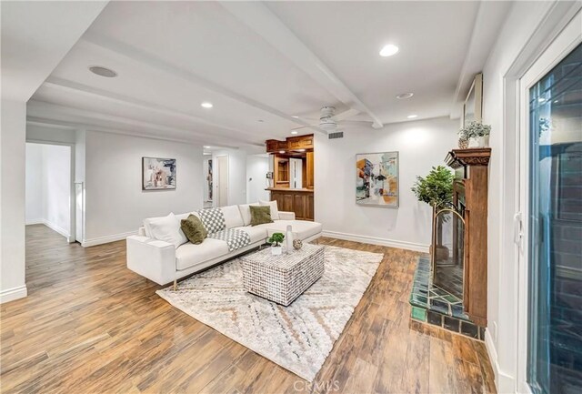 23216 Park Esperanza, Calabasas, CA 91302 - living area featuring baseboards, wood finished floors, ceiling fan, recessed lighting, and beamed ceiling