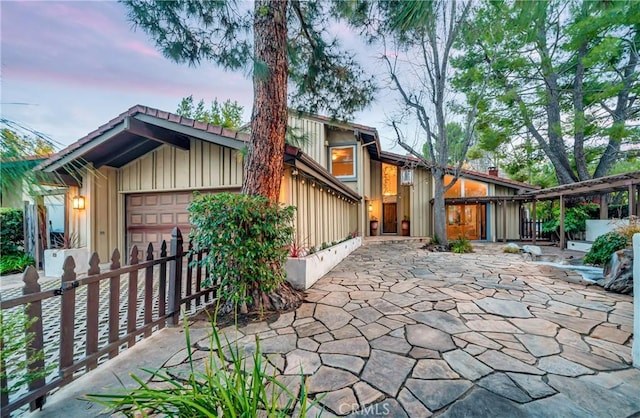 23216 Park Esperanza, Calabasas, CA 91302 - patio terrace at dusk with an attached garage and fence