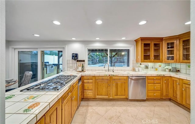 23216 Park Esperanza, Calabasas, CA 91302 - kitchen featuring stainless steel appliances, a sink, tile countertops, backsplash, and recessed lighting