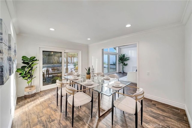 23216 Park Esperanza, Calabasas, CA 91302 - dining room featuring ornamental molding, wood finished floors, baseboards, and recessed lighting