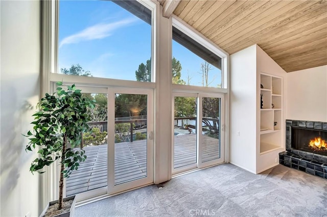 23216 Park Esperanza, Calabasas, CA 91302 - entryway with carpet floors, a tile fireplace, wooden ceiling, and vaulted ceiling