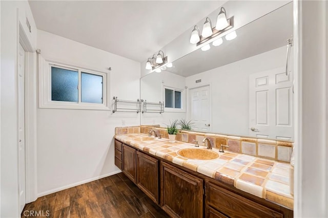 23216 Park Esperanza, Calabasas, CA 91302 - bathroom with wood finished floors, baseboards, and double vanity