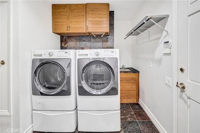 23216 Park Esperanza, Calabasas, CA 91302 - clothes washing area featuring baseboards, independent washer and dryer, stone tile flooring, and cabinet space