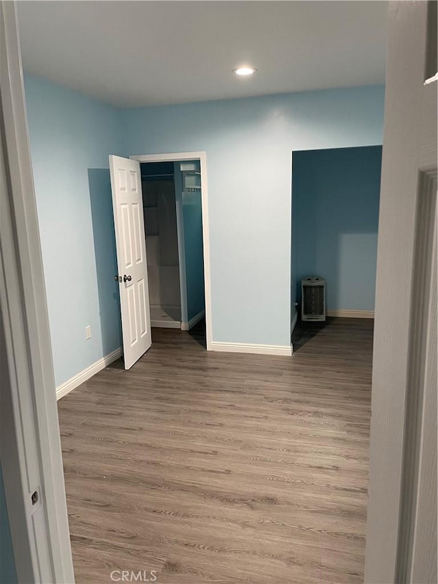 unfurnished room featuring hardwood / wood-style flooring