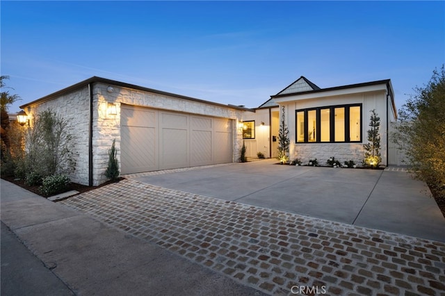 view of front of property with a garage