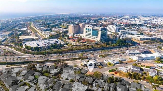 birds eye view of property featuring a city view