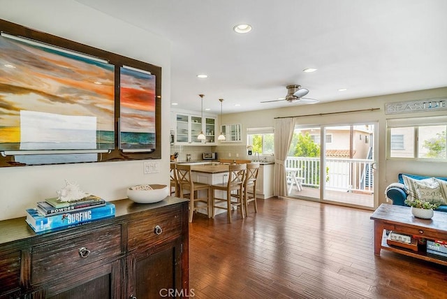 dining space with recessed lighting, a ceiling fan, and hardwood / wood-style floors