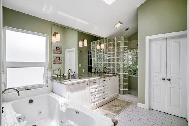 bathroom featuring tile patterned flooring, vanity, lofted ceiling, and shower with separate bathtub