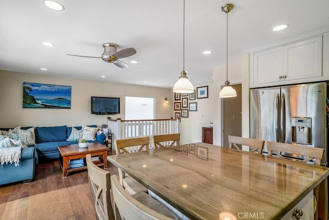 dining area with dark hardwood / wood-style flooring and ceiling fan