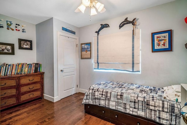 bedroom with ceiling fan and dark hardwood / wood-style flooring