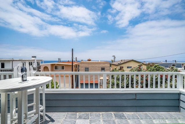 view of patio with an outdoor living space and a balcony