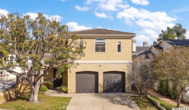 view of front of home with a garage