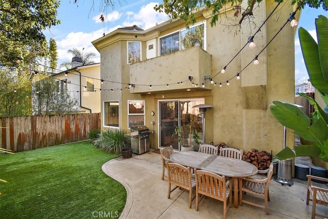 back of property featuring a patio and a yard