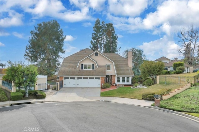 view of front of home featuring a garage and a front lawn