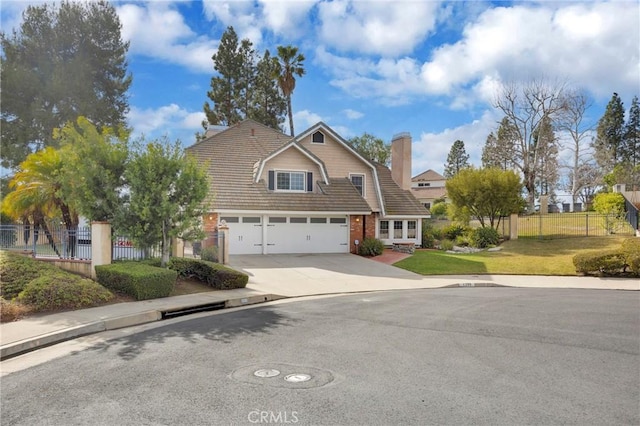 view of front of house with a garage and a front yard