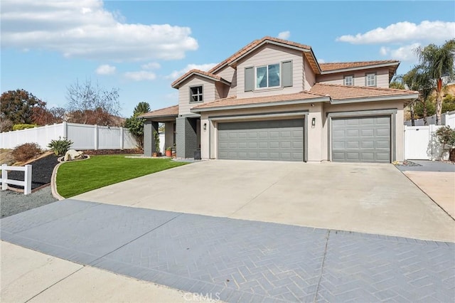 view of front of house with a garage and a front yard