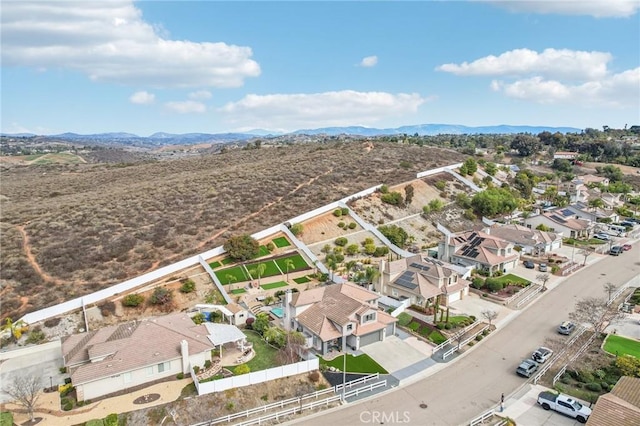 birds eye view of property featuring a mountain view