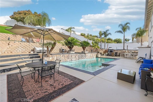 view of swimming pool with a patio area