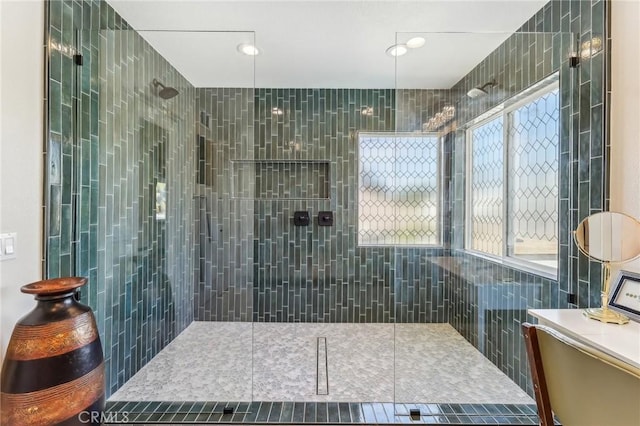 bathroom with a tile shower