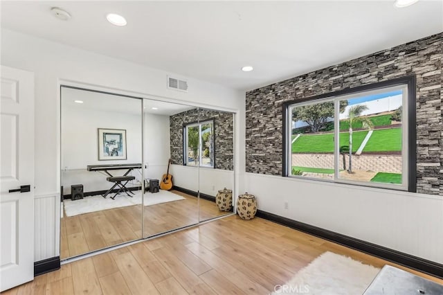 workout room featuring wood-type flooring