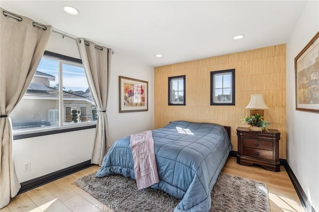 bedroom with light hardwood / wood-style flooring